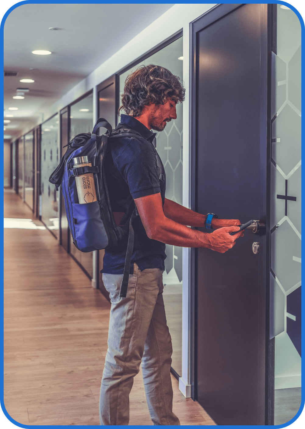 A person unlocking an office door with a smartphone