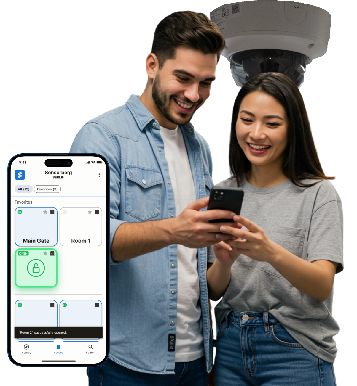 A couple with a smartphone and a CCTV camera in the background